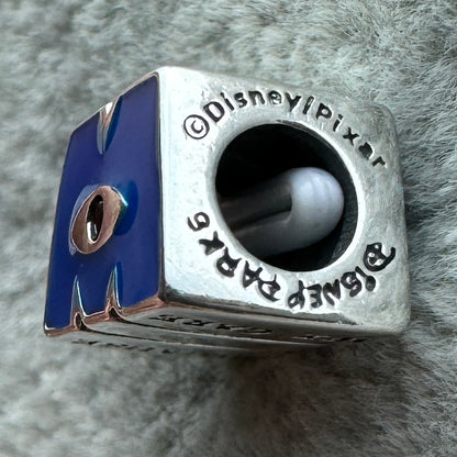 Charm Logotipo Monsters Inc. Disney