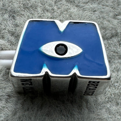 Charm Logotipo Monsters Inc. Disney