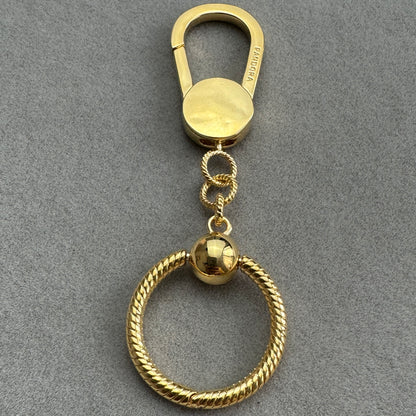 Llavero Baño Dorado